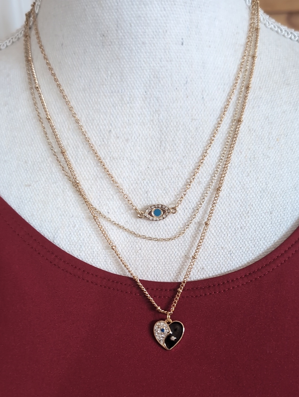 G By Guess Goldtone Layered Necklace with Heart and Eye Charms NWT